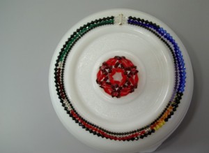 Photograph of necklace representing the genome of phiX174