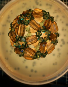 Photograph of beaded art piece called "Counting Plates"