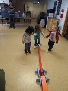Kids test their balance on both narrow and wide balance beams.