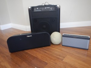 The three speakers I tested, with a cantelope for scale.