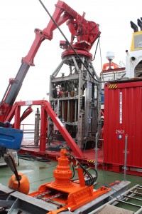 Photo of Rock Drill 2 (RD2), owned by the British Geological Survey, being deployed at 30°N near the Mid-Atlantic Ridge. The drill holds a carrousel of core barrels that allow penetration to a depth of up to 50 m below the seafloor. Image courtesy of Y. Morono (JAMSTEC).
